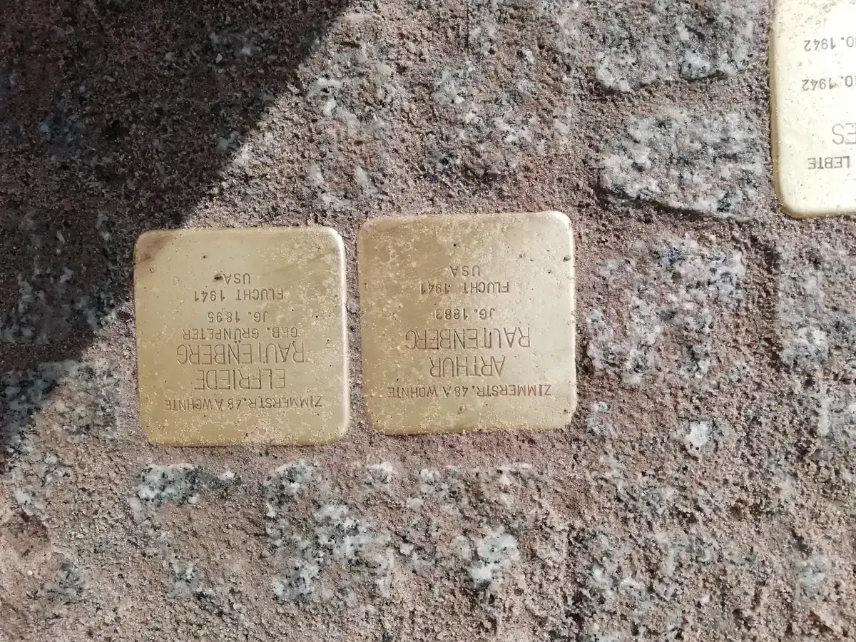 Close-up of Stolpersteine in Berlin pavement